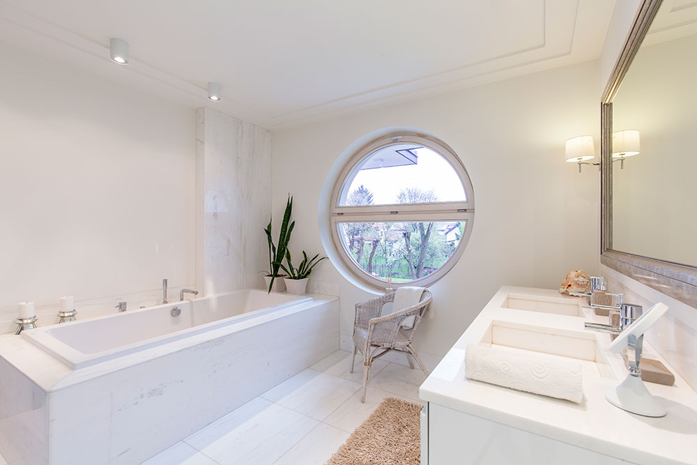 bright bathroom with round window PH65K5M