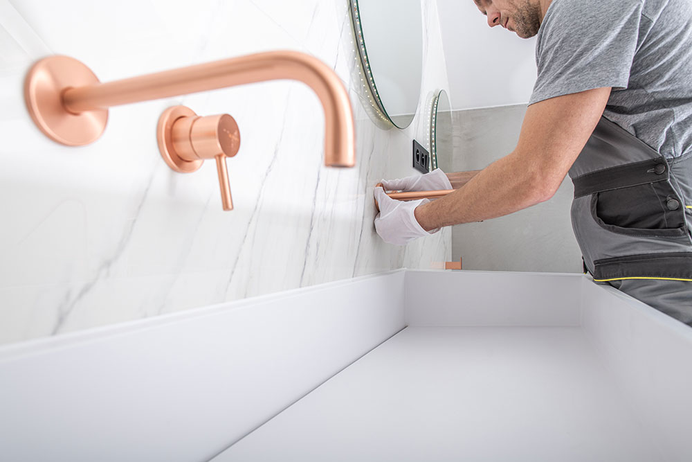 copper bathroom facuet installation by handyman YGY8XB8